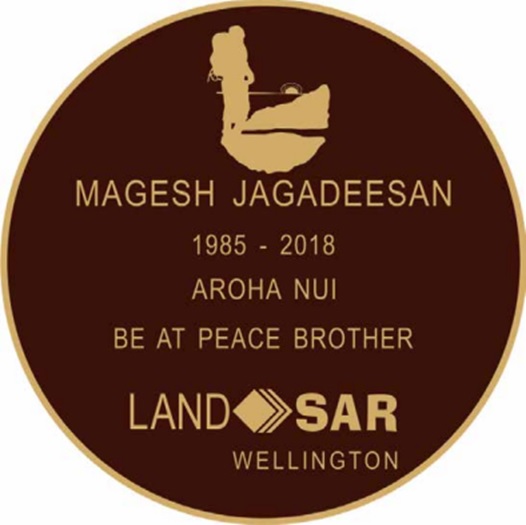 Memorial Plaque that has a silhouette of a tramper on top of a mountain. It reads Magesh Jagadeesan, 1985 - 2018, Aroha nui, Be at peace brother, LandSAR Wellington.